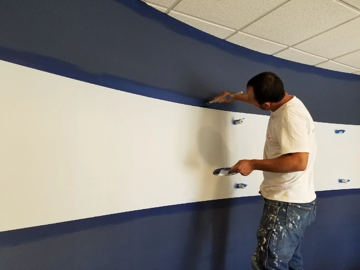 Painter painting a commercial interior