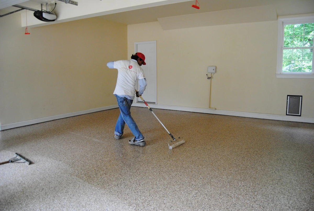 Anderson Painting contractor coating garage floor