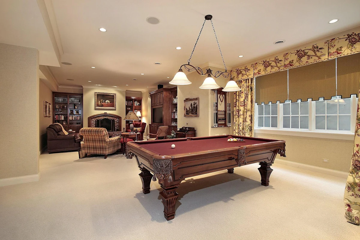 Newly painted rec room with a pool table