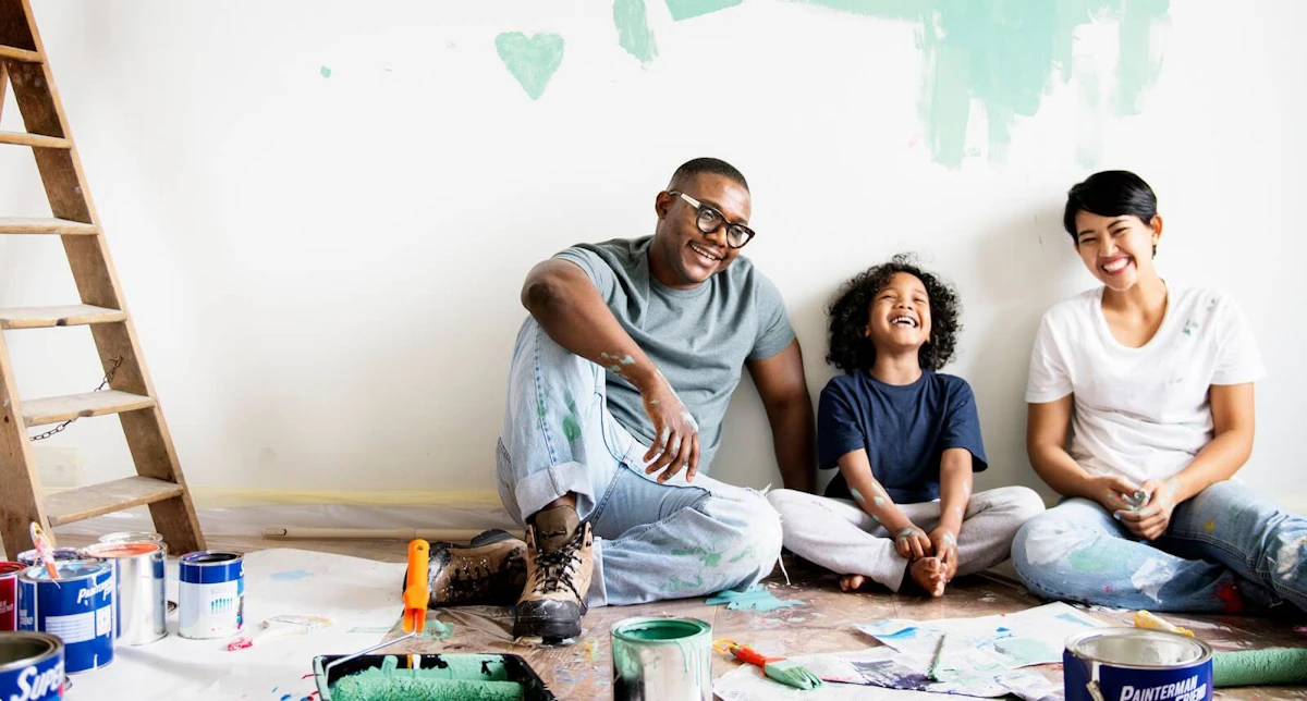 Parents with child during home painting