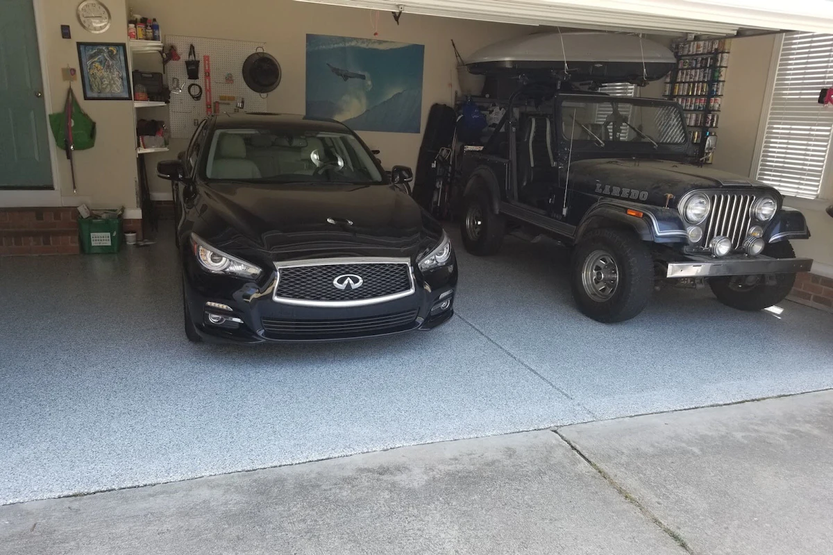 Two cars on newly painted garage floor