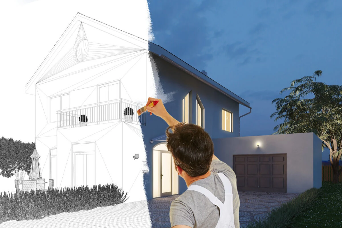 Man painting on a sketch drawing of a house